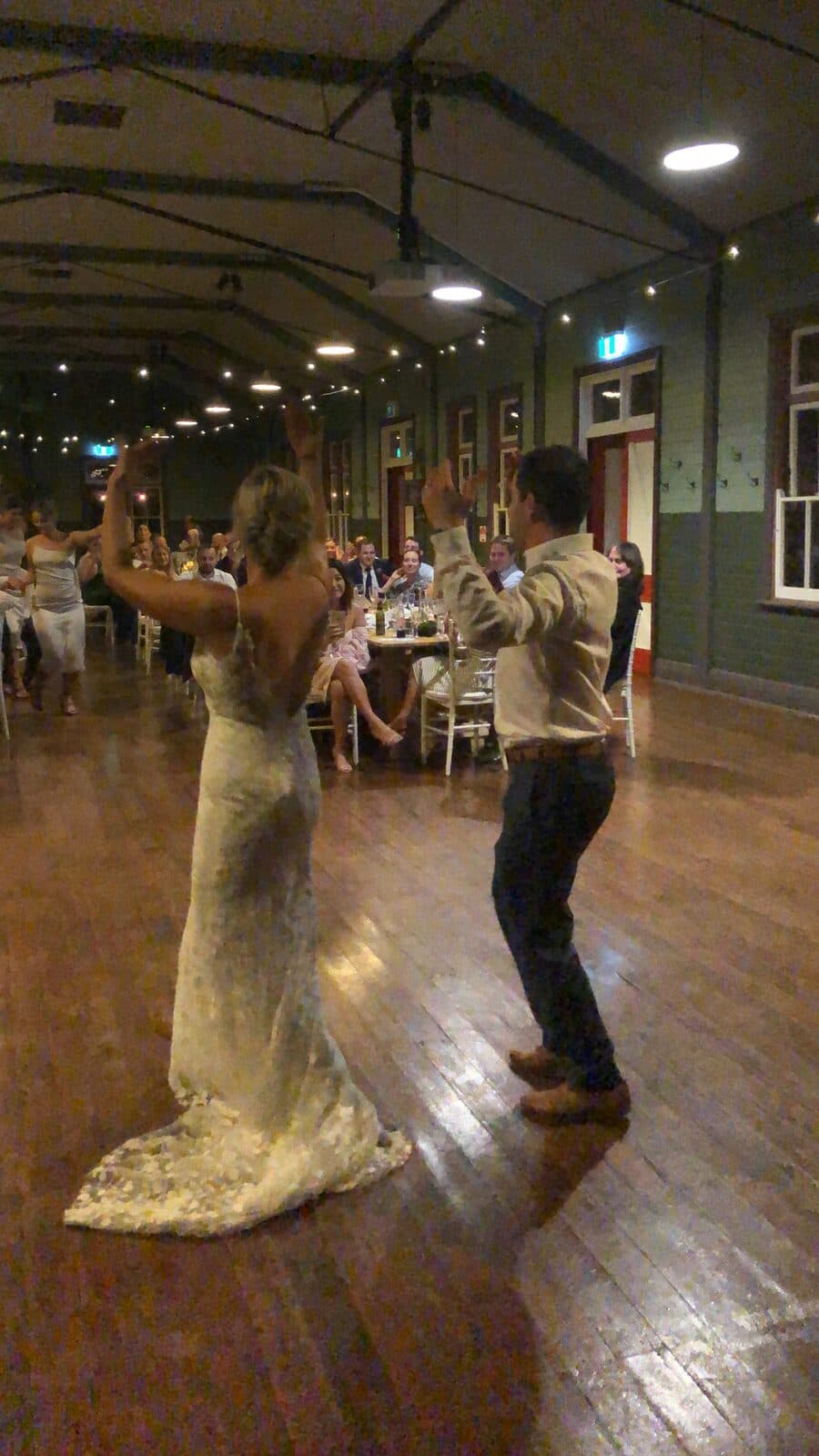 Bride and groom celebrating on the dance floor