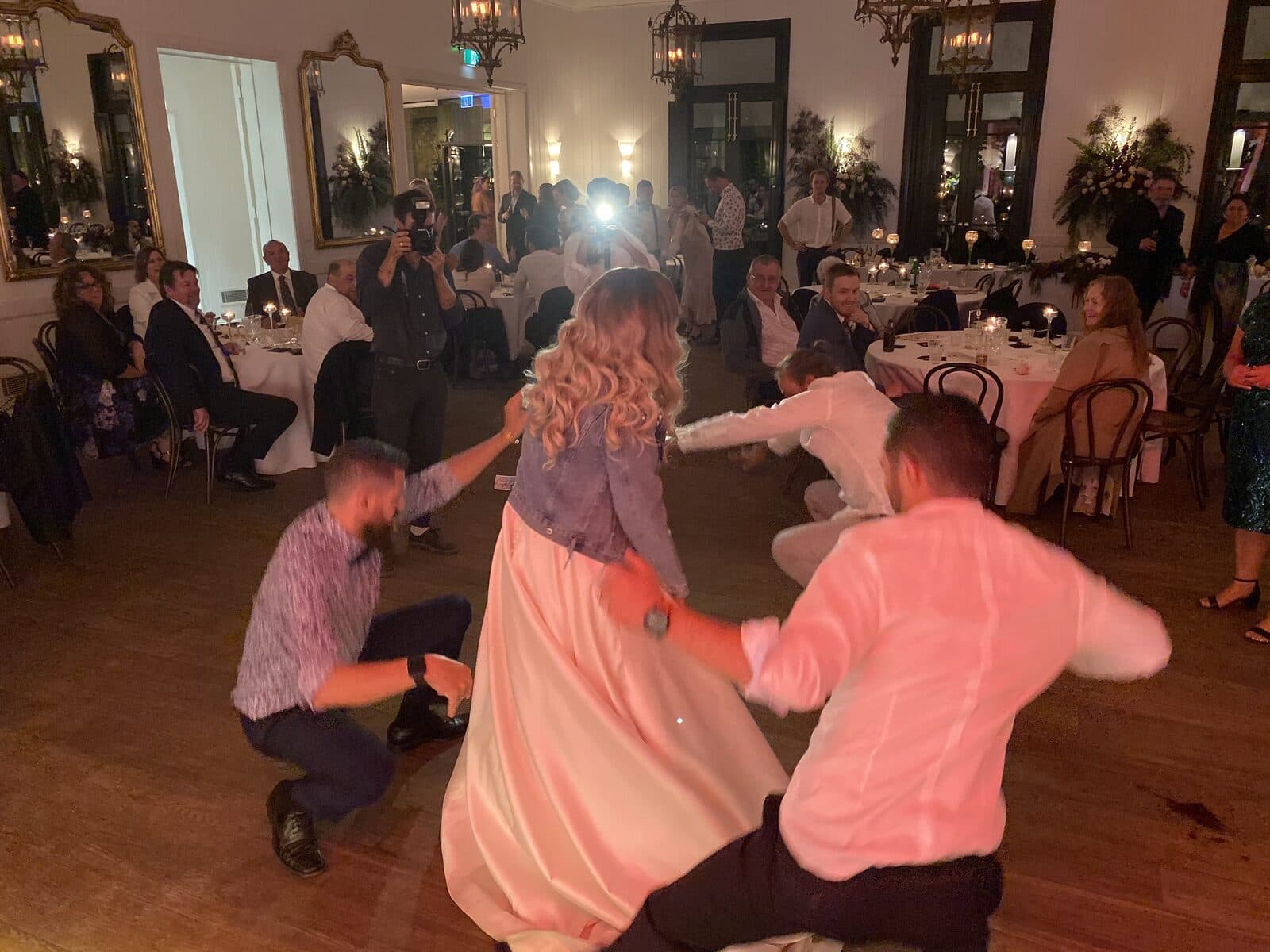 Late-night dance floor moment with candlelight